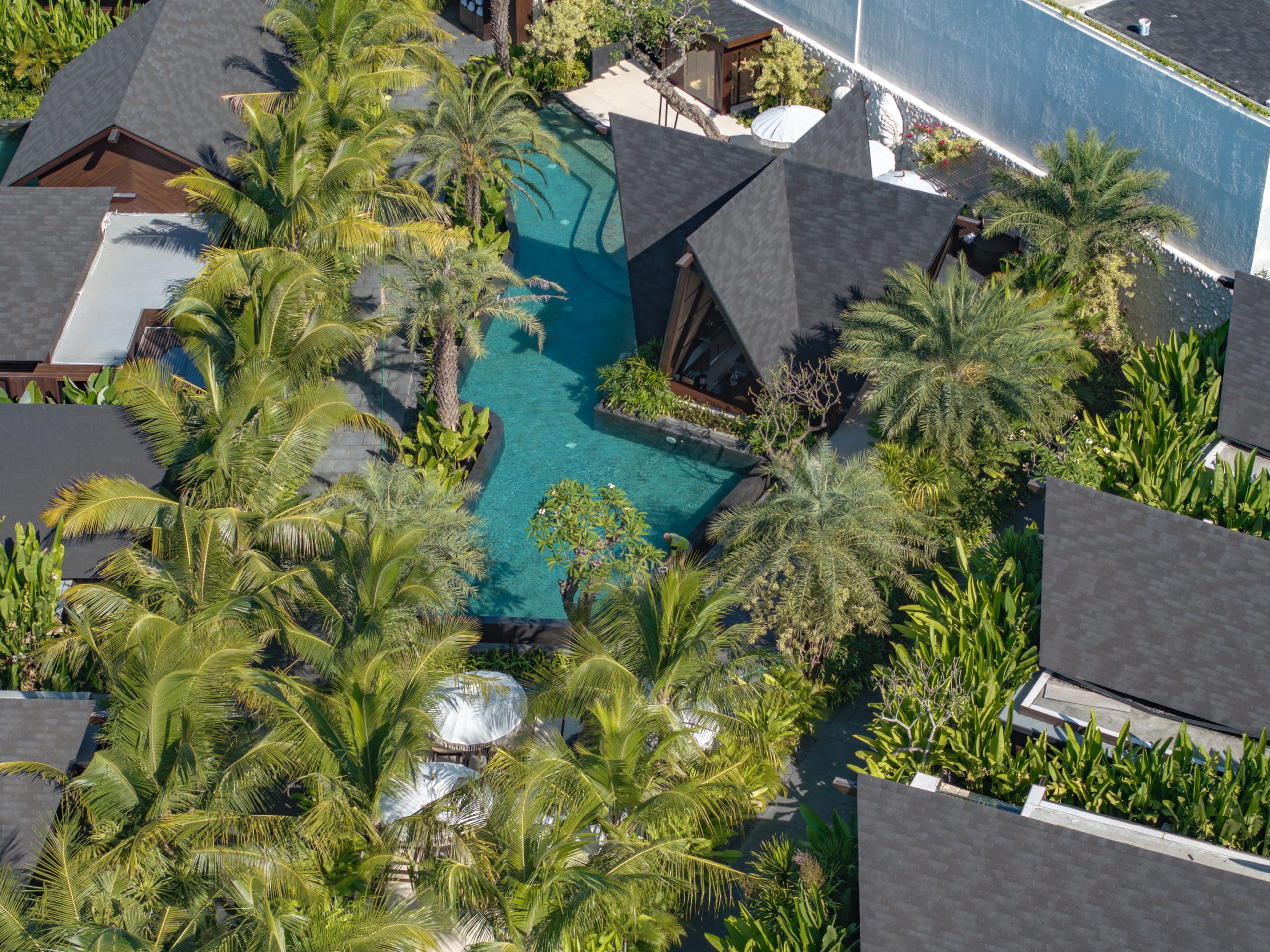 Aerial view of the main pool and villas at Nuju Uluwatu