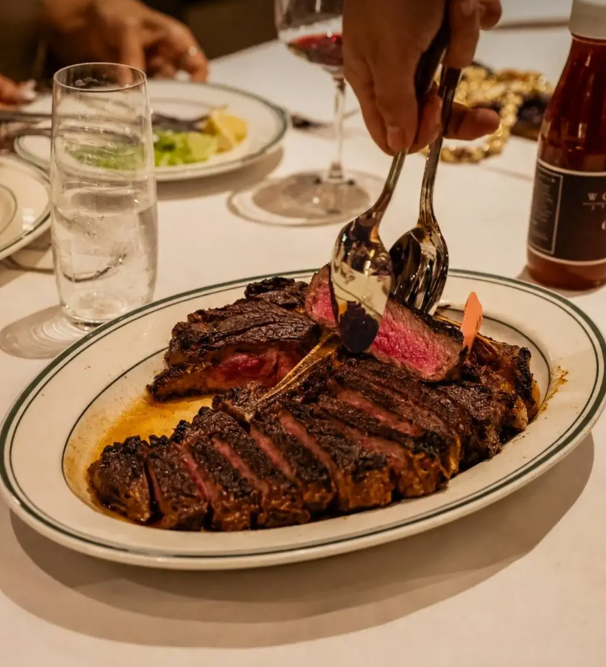 Wolfgang’s Steakhouse Porterhouse served sliced on a sizzling platter in Bali